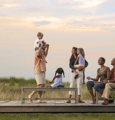 Family and Friends gathering on deck watching the sunset