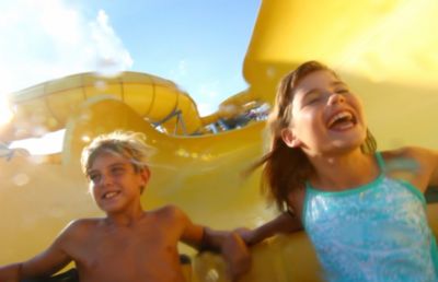 Kids sliding down water slide