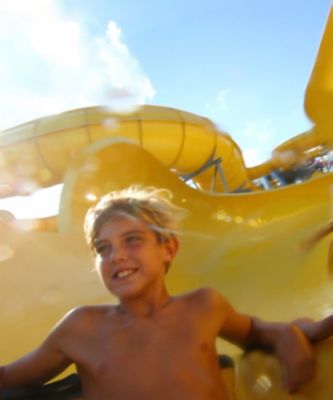 Kids sliding down water slide