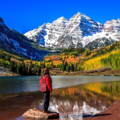 Woman admiring the lake view at Maroon Bells Mountains