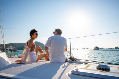 couple talking together catamaran boat sailing sunset