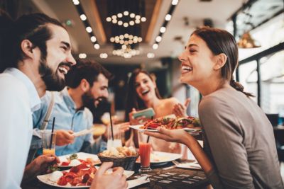 friends having breakfast in restaurant together