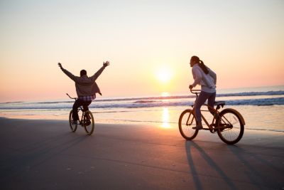 Myrtle beach couple beach biking sunset
