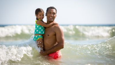 Father and Daughter In the Ocean