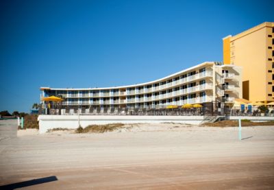 Outrigger Beach Club exterior on the beach