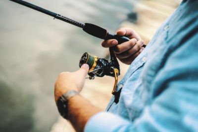 person holding fishing pole