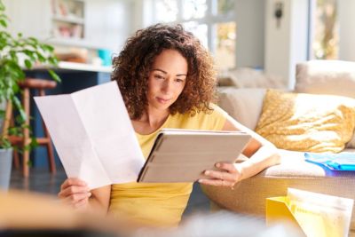 woman checking home finances online